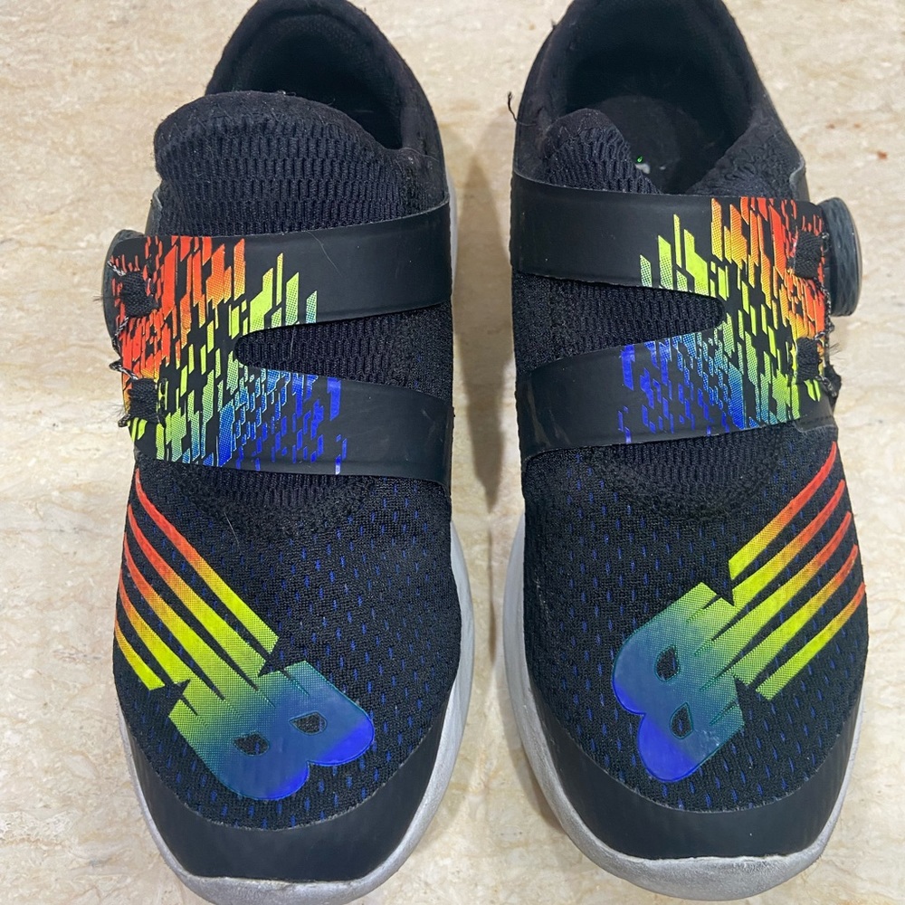 Girls size 2 new balance sneakers gently worn.